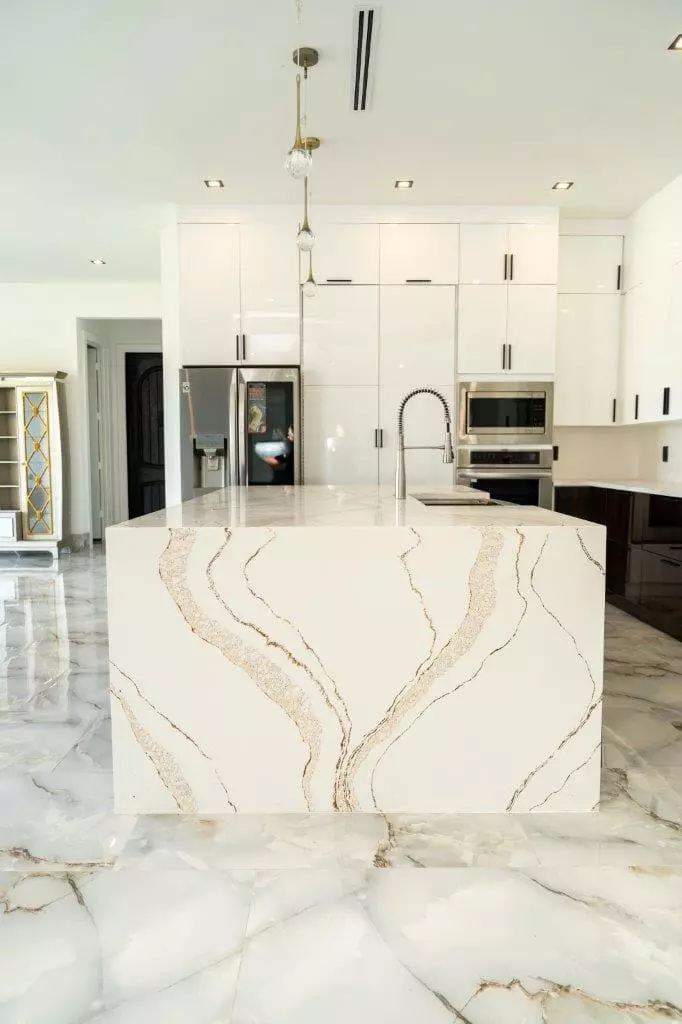 Stunning kitchen with wave pattern quartz countertops and waterfall design that add a touch of luxury