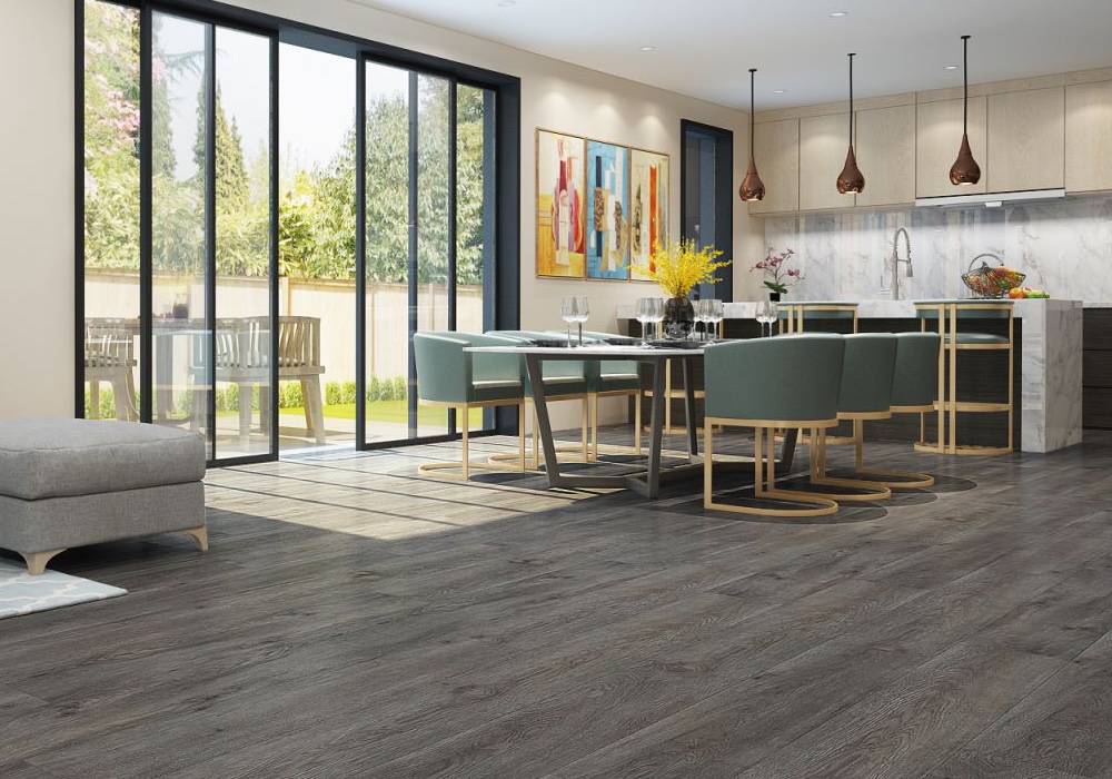 Modern kitchen and dining area with dark wood-look luxury vinyl plank flooring and natural light